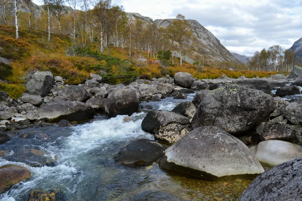 Måna river running through boulders below Månafossen in the Frafjord valley