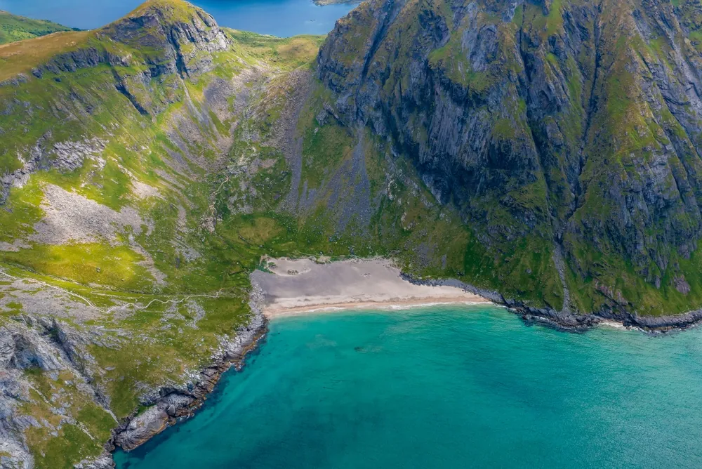 Turquoise Kvalvika bay seen from Ryten in Lofoten